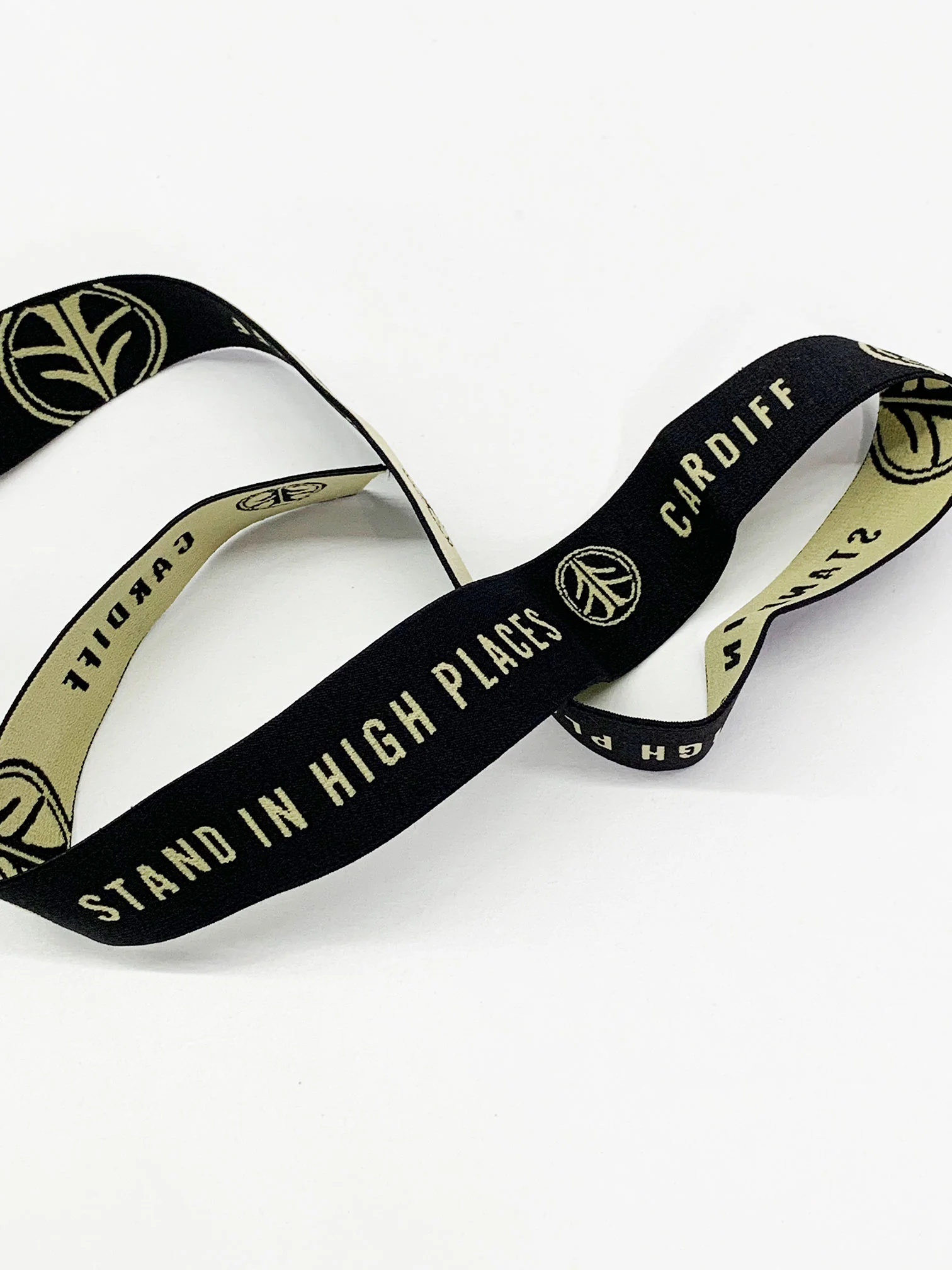 1 1/4" Black/Tan Branded Text Medallion Jacquard Elastic - Corbeaux Clothing - BY THE 5 YARD PIECE